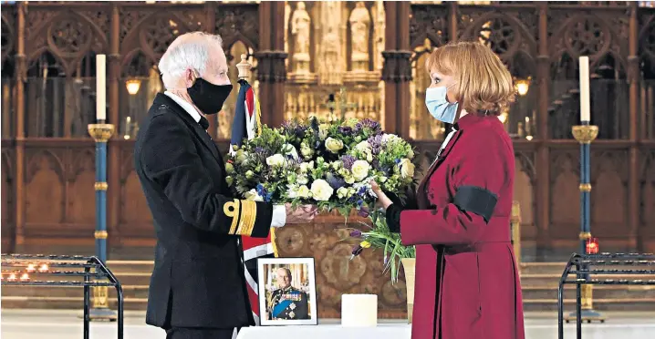  ??  ?? Churches, including Winchester Cathedral, above, and communitie­s across the nation have paid homage to the Duke of Edinburgh; mourners lay flowers at the gates to Windsor Castle at the top of the Long Walk, left and right