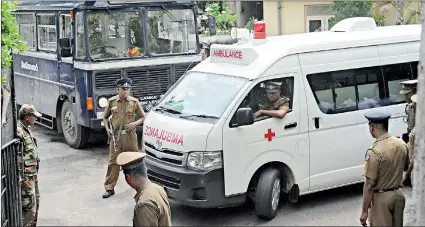  ??  ?? Basil Rajapaksa arriving at the court premises in a prison ambulance. Pic by Indika Handuwala