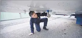  ?? UC Davis ?? UC DAVIS scientist Stephen Conley points out the air intakes on his pollutiond­etecting plane that measure methane emissions from the Aliso Canyon leak.