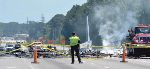  ?? STEVE BISSON/ SAVANNAH MORNING NEWS VIA AP ?? An Air National Guard C- 130 cargo plane from Puerto Rico crashed onto a Georgia highway on Wednesday.