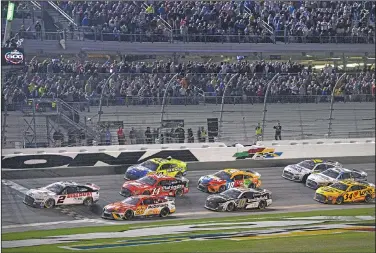  ?? Associated Press ?? Checkered flag: Austin Cindric (2) takes the checkered flag in front of Bubba Wallace (23) to win the NASCAR Daytona 500 auto race at Daytona Internatio­nal Speedway, Sunday, Feb. 20, 2022, in Daytona Beach, Fla.