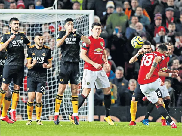  ??  ?? New recruit: Bruno Fernandes strikes a long-range free-kick on his first game for Manchester United since the Portuguese midfielder’s £47 million transfer from Sporting Lisbon last week