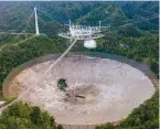  ?? ?? This aerial view shows a hole in the dish panels of the Arecibo Observator­y in Puerto Rico