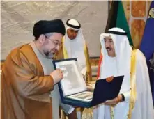  ??  ?? KUWAIT: Iraqi figure Dr Ibrahim Mohammad Bahr Al-Ulloum (left) presents a book on Bahr Al-Oloum charity organizati­on’s activities to His Highness the Amir Sheikh Sabah Al-Ahmad Al-Jaber Al-Sabah.