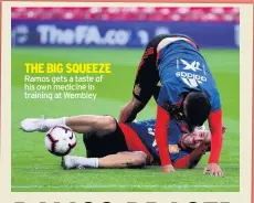  ??  ?? THE BIG SQUEEZE Ramos gets a taste of his own medicine in training at Wembley