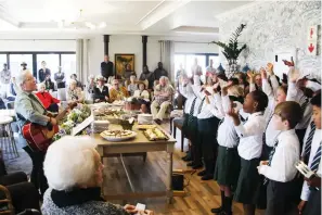  ?? ?? The Howick Prep Dinky Choir, entertaini­ng residents at Amber Glades’ first birthday celebratio­n.