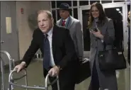  ?? MARY ALTAFFER — THE ASSOCIATED PRESS ?? Harvey Weinstein, left, leaves the courtroom with his attorneys Arthur Aidala, and Donna Rotunno at the end of the first day of his trial on rape and sexual assault charges Wednesday in New York.