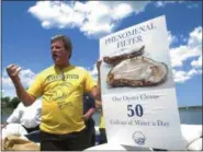  ??  ?? In this June 2, 2017 photo, Tim Dillingham, president of the American Littoral Society, addresses volunteer “oyster wranglers” with the American Littoral Society in Red Bank, N.J.