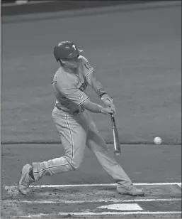  ?? Miami Herald/tns ?? Philadelph­ia Phillies catcher J.T. Realmuto drives in a run against the Miami Marlins on September 10, 2020, at Marlins Park in Miami.