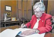  ?? HAL YEAGER/ALABAMA GOVERNOR’S OFFICE ?? Alabama Gov. Kay Ivey, who signed the bill into law May 15, said after Tuesday’s ruling she supports the “rule of law.”