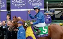  ?? AFP ?? William Buick, astride Line of Duty, celebrates after winning the Breeders’ Cup Juvenile Turf race. —