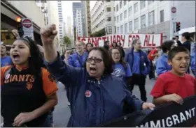  ?? THE ASSOCIATED PRESS ?? Guadalupe Chavez, center, and others yell during a protest outside of the U.S. Citizen and Immigratio­n Services building in San Francisco on Monday.