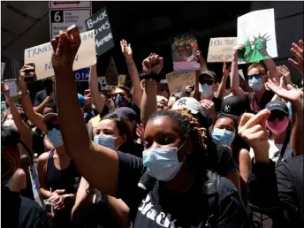  ?? Photo/Seth Wenig
AP ?? Protesters rally near the edge of Times Square in New York on Sunday.