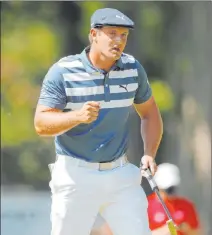  ?? Carlos Osorio The Associated Press ?? A larger, more powerful Bryson Dechambeau pumps his fist after a birdie in Sunday’s final round of the Rocket Mortgage Classic.