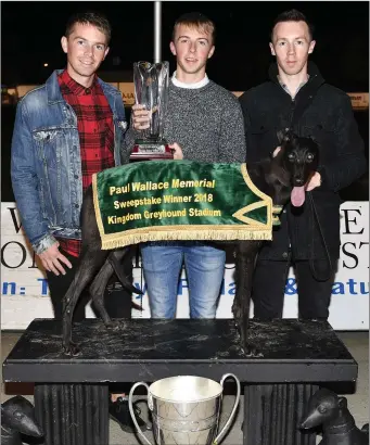  ?? Photo by www.deniswalsh­photograph­y.com ?? Robert, Jason and Seán Wallace from Lixnaw with the winning Paul Wallace Memorial Buster Stakes trophy they presented to the owner of the winning greyhound, Millridge Zoey, at the Lixnaw GAA Developmen­t fundraisin­g night at the dogs on Saturday.
