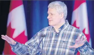  ?? CP PHOTO ?? Prime Minister Stephen Harper speaks at the Calgary Stampede earlier this month. Analysis shows a long federal election campaign might favour Conservati­ves ridings which are flush with cash.