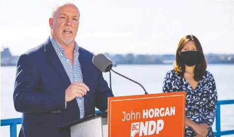  ?? — FRANCIS GEORGIAN ?? NDP Leader John Horgan visited the riding of North Vancouver-Lonsdale on Tuesday, where he and candidate Bowinn Ma said the B.C. Liberals would cut health care to fund tax giveaways for the wealthy.