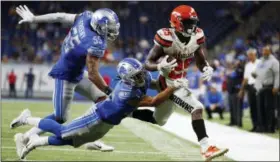  ?? RICK OSENTOSKI — THE ASSOCIATED PRESS ?? Lions defensive back Mike Ford (38) helps push Browns running back Dontrell Hilliard (25) out of bounds during the second half on Aug. 30 in Detroit.