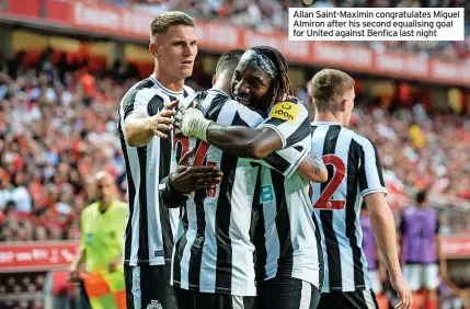  ?? ?? Allan Saint-Maximin congratula­tes Miguel Almiron after his second equalising goal for United against Benfica last night