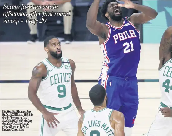  ?? KIM KLEMENT POOL — PHOTO VIA AP ?? Boston Celtics center Robert Williams III (44) fouls Sixers center Joel Embiid (21) during Sunday’s first-round playoff game in Lake Buena Vista, Fla.