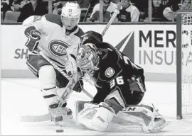  ?? Luis Sinco Los Angeles Times ?? DUCKS GOALIE John Gibson is able to fend off this attempt from close range by Montreal’s David Desharnais. Gibson had a shutout for the first 58 minutes.