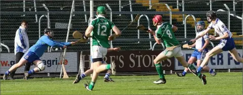  ??  ?? Cloughbawn midfielder Connal Flood (8) scoring his memorable first-half goal after a piercing solo run.