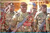  ?? — AFP ?? BAMAKO: Soldiers are pictured during the funeral of Griot singer Kasse Mady Diabate in Bamako. Fifty-three soldiers were killed in a ‘terrorist attack’ on a Mali military post in the northeast of the country.