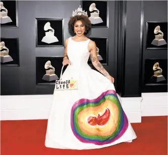  ??  ?? Evan Agostini / Associated Press
arrives at the Grammy Awards in a fetus-festooned gown to send an anti-abortion message.