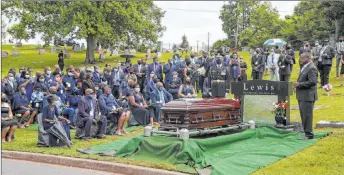  ?? Alyssa Pointer The Associated Press ?? Mourners attend the burial service for Rep. John Lewis at Southview Cemetery in Atlanta on Thursday.