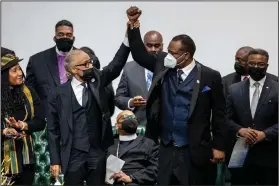  ?? (AP/The Grand Rapids Press/Cory Morse) ?? The Rev. Al Sharpton (left) acknowledg­es Kent County Commission­er Robert S. Womack during the funeral Friday for Patrick Lyoya at the Renaissanc­e Church of God in Christ Family Life Center in Grand Rapids, Mich. More photos at arkansason­line.com/423lyoya/.