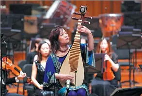  ?? PHOTOS PROVIDED TO CHINA DAILY ?? Chinese pipa player Wu Man (above) and French cellist Gautier Capucon (top) are touring with the NCPA Orchestra in North America.