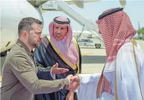  ?? SAUDI PRESS AGENCY VIA AP, FILE ?? Ukraine’s President Volodymyr Zelenskyy, left, is greeted by Prince Badr Bin Sultan upon his arrival in Saudi Arabia on Friday to meet with Arab leaders. Zelenskyy has launched a diplomatic world tour to shore up support for defending his country.