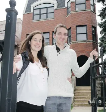  ?? CHARLES REX ARBOGAST/ THE ASSOCIATED PRESS ?? Emily and Brian Townsend outside their home where they own the top floor unit in a three-flat building in Chicago. The couple was surprised by the hidden costs.