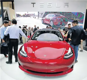  ?? Picture: Reuters/Jason Lee ?? A Tesla Model 3 electric car displayed at the Auto China 2018 motor show in Beijing last year.