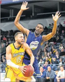  ?? MIKE HENSEN/LONDON FREE PRESS ?? Xavier Ford of the St. John’s Edge defends against the London Lightning’s Garrett Williamson during play in Game 6 of their National Basketball League of Canada playoff series Sunday in London, Ont. The Edge were ousted with a 106-101 loss.