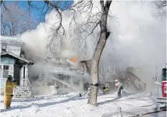  ??  ?? Fighting Monday’s house fire was complicate­d by temperatur­es at -25, which felt like -35 with wind chill factored in.