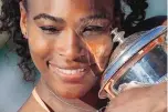 ?? THE ASSOCIATED PRESS FILE ?? Serena Williams holds the trophy after winning the French Open in June. She is the AP Female Athlete of the Year for the fourth time.