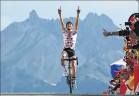  ?? CHRIS GRAYTHEN / GETTY IMAGES ?? Frenchman Warren Barguil crosses the line to win Stage 18 Thursday in the Alps. It was Barguil’s second stage victory of the Tour.