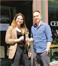  ?? ?? Cellar 159 associate winemaker and tasting room manager Erika Assise and winemaker Brian Crew pose outside the business, which opened April 1 at 159 Northampto­n St. in downtown Easton.
