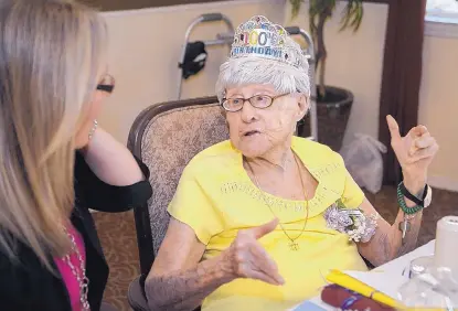  ?? GREG SORBER/JOURNAL ?? Rosalyn Zimmerman talks with her granddaugh­ter Sara Penn during Zimmerman’s 100th birthday celebratio­n July 27 at Albuquerqu­e’s Atria Vista del Rio assisted living facility. Zimmerman, who taught at Cresskill High School in Cresskill, N.J., in the 1960s, ’70s and ’80s, is still remembered with affection and admiration by her Cresskill students.