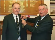  ??  ?? New Co Sligo Captain Kevin Flanagan receiving his pin of office form outgoing Captain Joe Keyes.