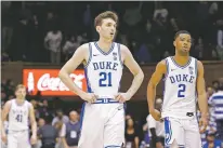  ?? GERRY BROOME/ASSOCIATED PRESS ?? Duke forward Matthew Hurt, center, and guard Cassius Stanley react following the team’s loss to Stephen F. Austin in overtime on Tuesday in Durham, N.C.