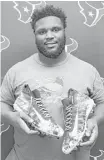  ?? Yi-Chin Lee / Houston Chronicle ?? D.J. Reader will don his customized cleats in honor of his father against the Titans.