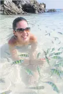  ??  ?? A tourist swims with fish in crystal clear waters near Similan National Park in Phangnga province, which is banning overnight stays.