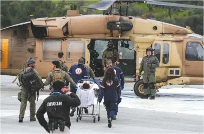  ?? (Ayal Margolin/Flash90) ?? A MILITARY HELICOPTER evacuates people injured by a missile fired by Hezbollah to Ziv Medical Center in Safed in February.