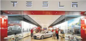  ?? ASSOCIATED PRESS FILE PHOTO ?? The Tesla showroom at the Washington Square Mall is seen in Portland, Ore.