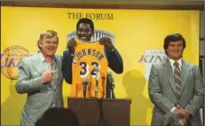  ?? (HBO) ?? John c. Reilly (from left) stars as Jerry Buss, Quincy Isiah is Earvin “Magic” Johnson and Jason Clarke is Jerry West in HBO’s “Winning Time: The Rise of the Lakers Dynasty.”