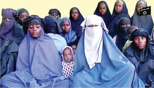  ?? Photo: AFP ?? Fourteen of the abducted Chibok schoolgirl­s in a video grab made yesterday from a video released by Boko Haram insurgents.