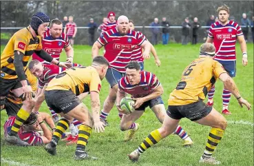  ?? Picture: Adam Hookway ?? Canterbury close in on Tonbridge Juddians’ Matt Walsh during last Saturday’s National League 2 East clash