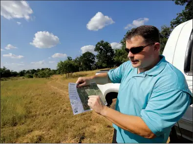  ?? AP/ERIC GAY ?? Heath Frantzen uses a map to point out where the proposed natural gas pipeline would cross his 260-acre ranch in central Texas.